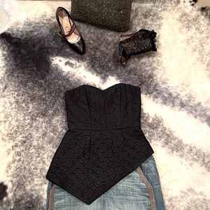 Black strapless corset top w/ asymmetric peplum detail, XS. Excellent condition!